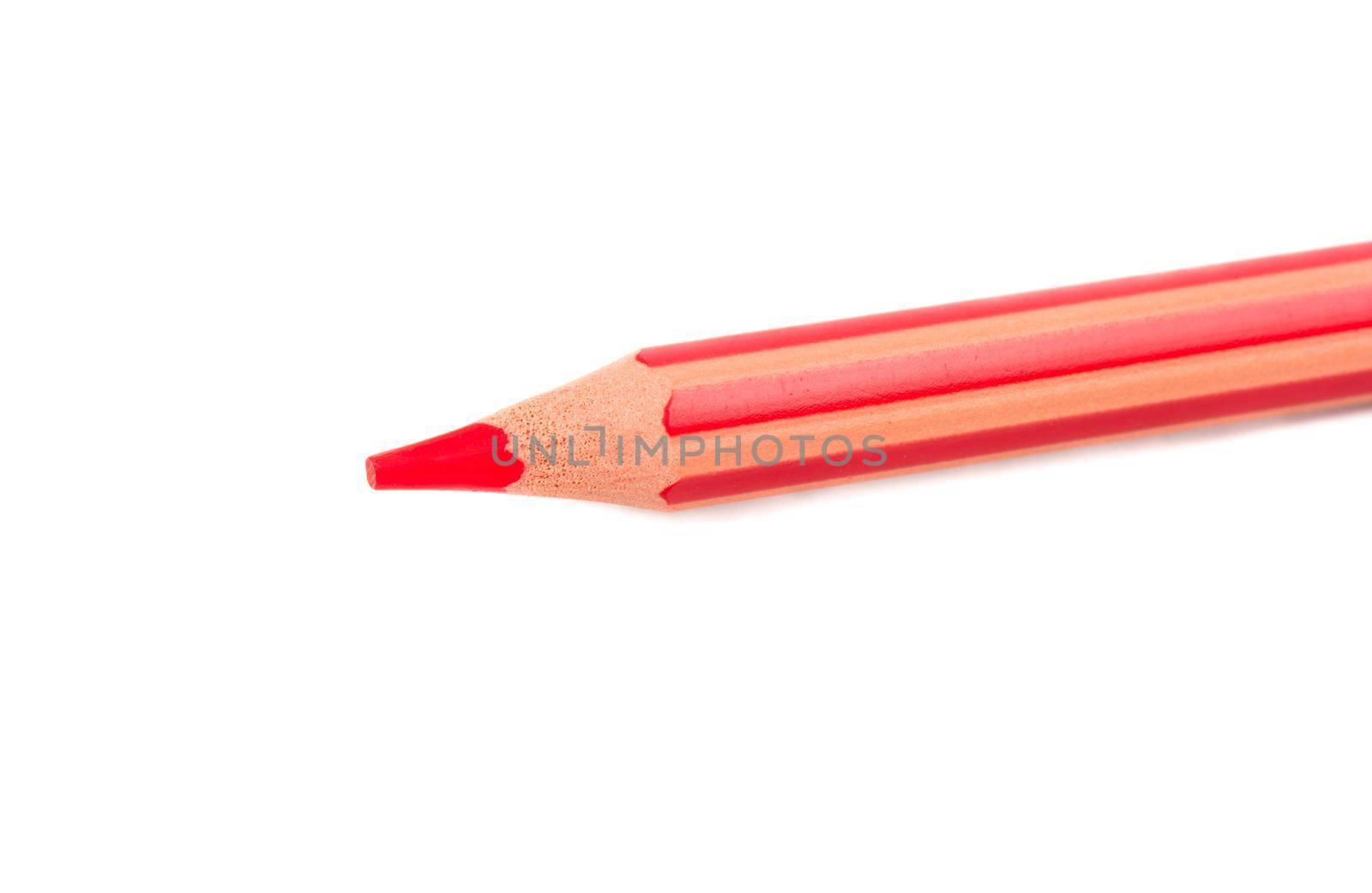 Red pencil close up on white background