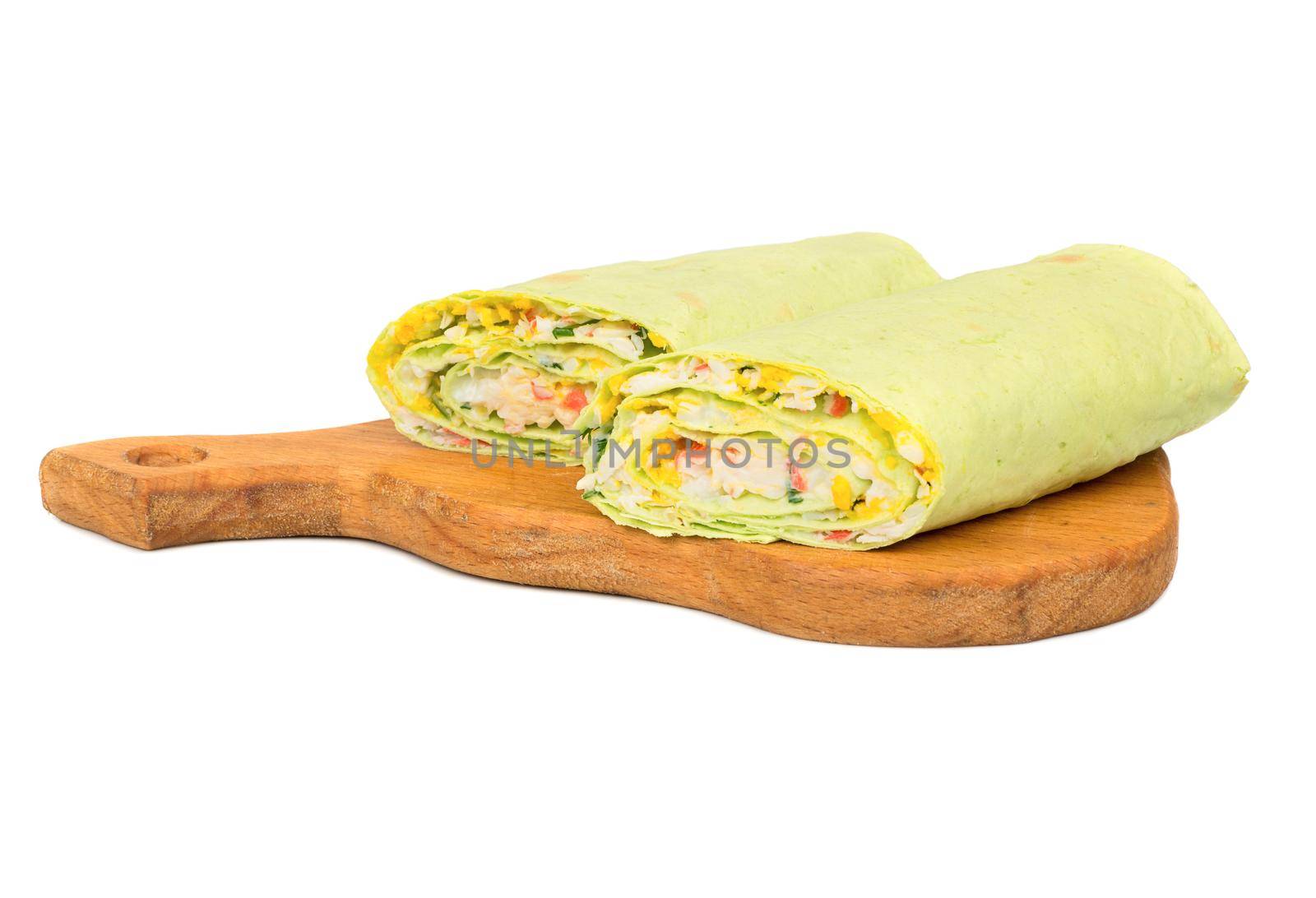 Green stuffed pita bread on cutting board on white background