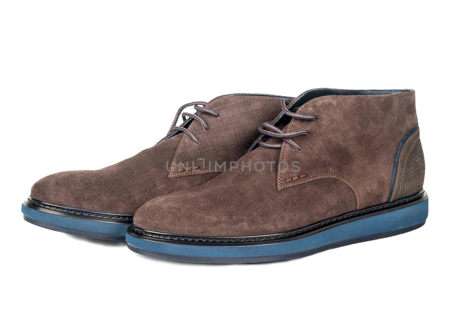 Beautiful brown suede shoes on white background