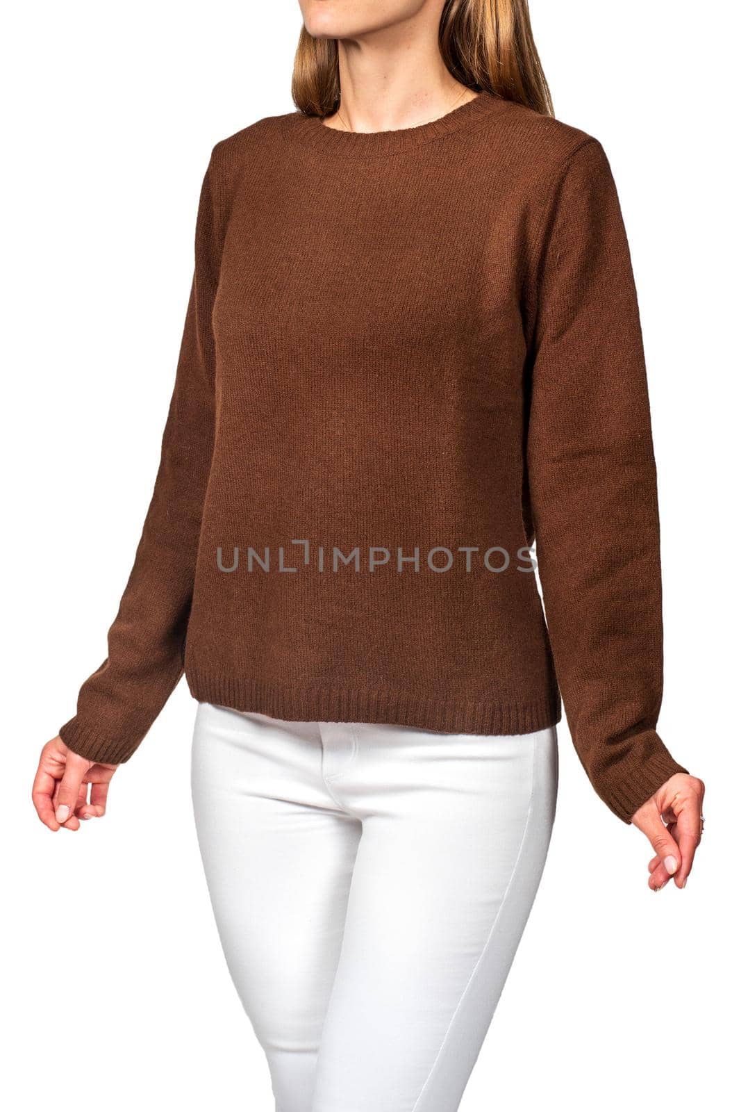 Young girl in a brown sweater over a white background