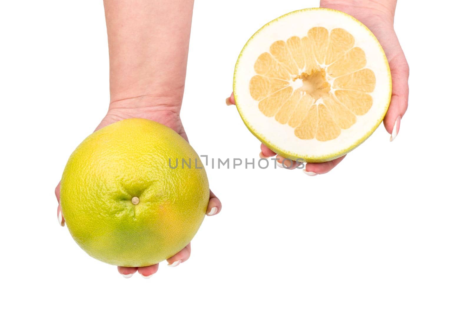 Full oroblanco fruit with half in hands on a white background