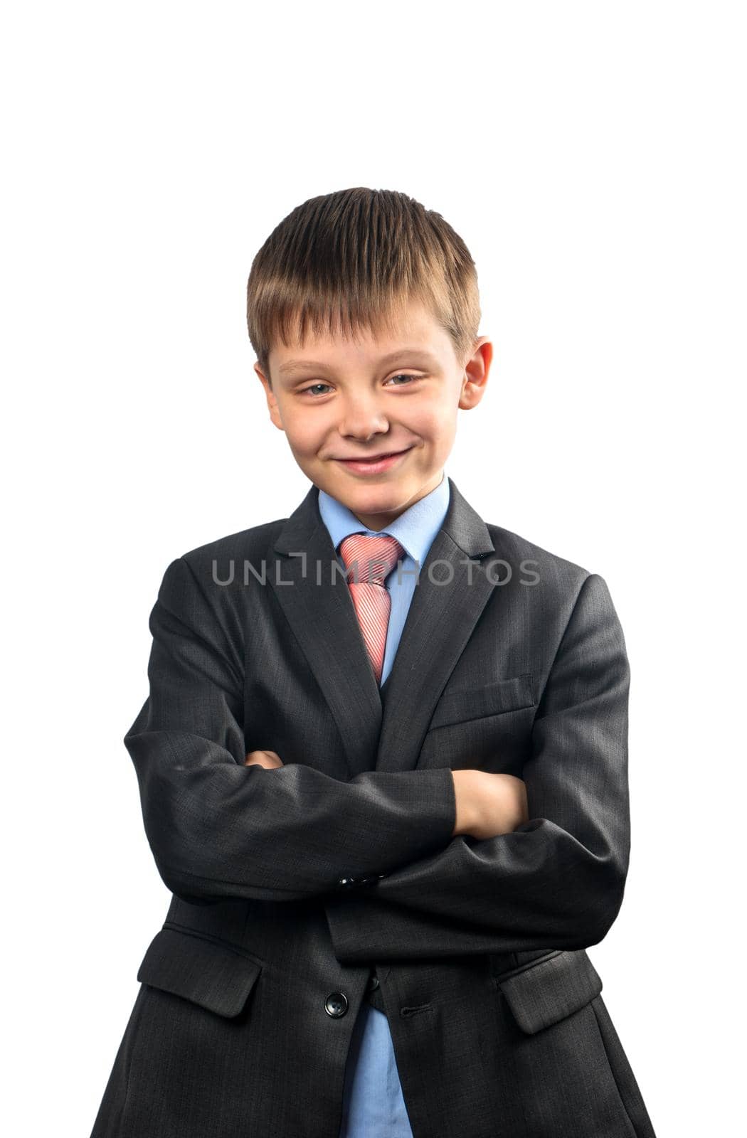 Portrait of a cheerful schoolboy in blazer on white background