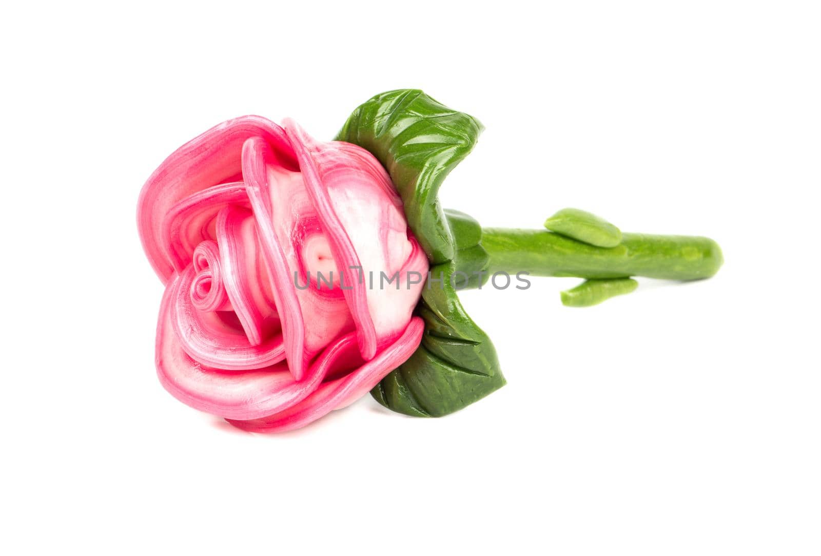 Beautiful candy rose from caramel on a white background