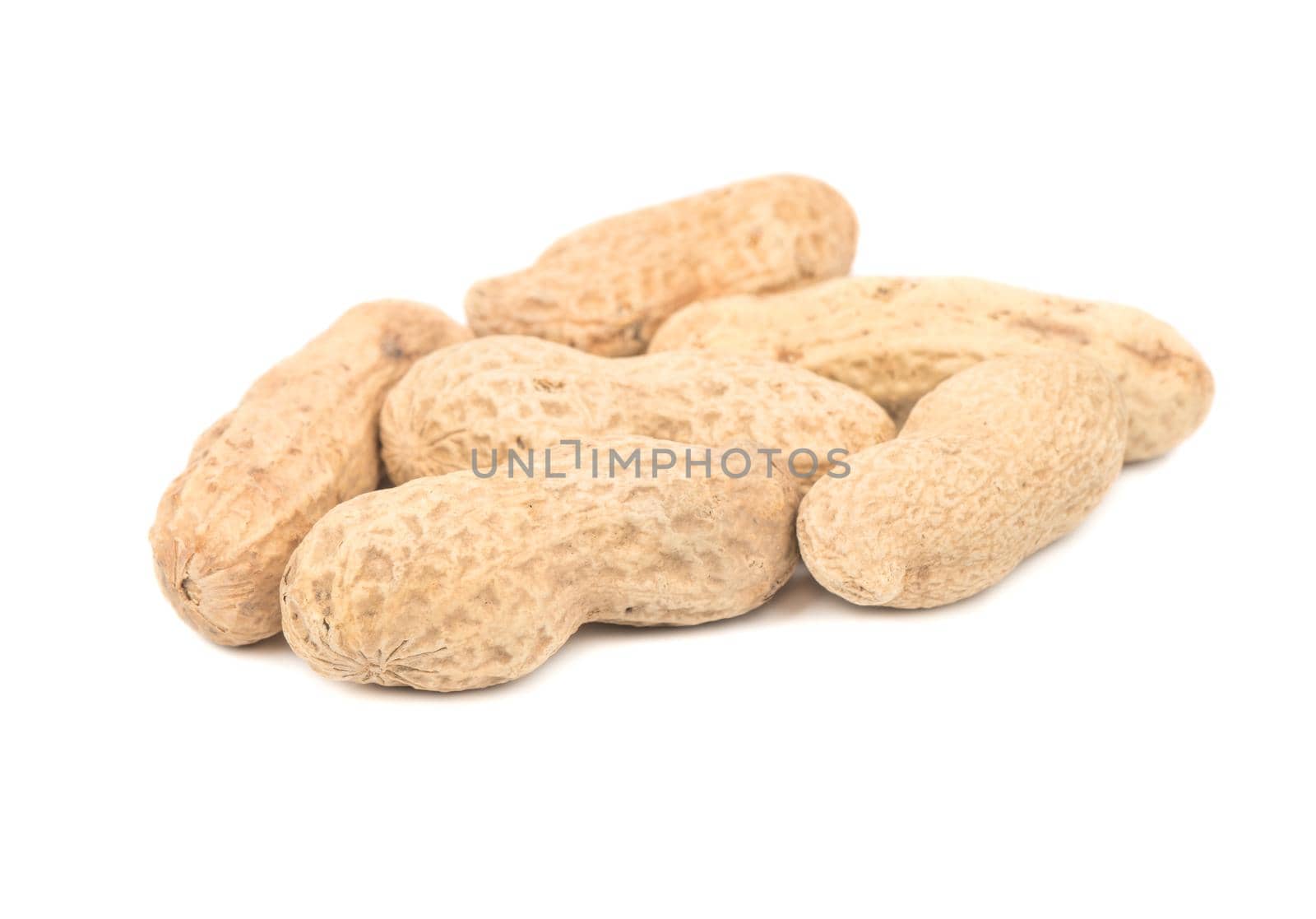Several peanuts in shell on a white background