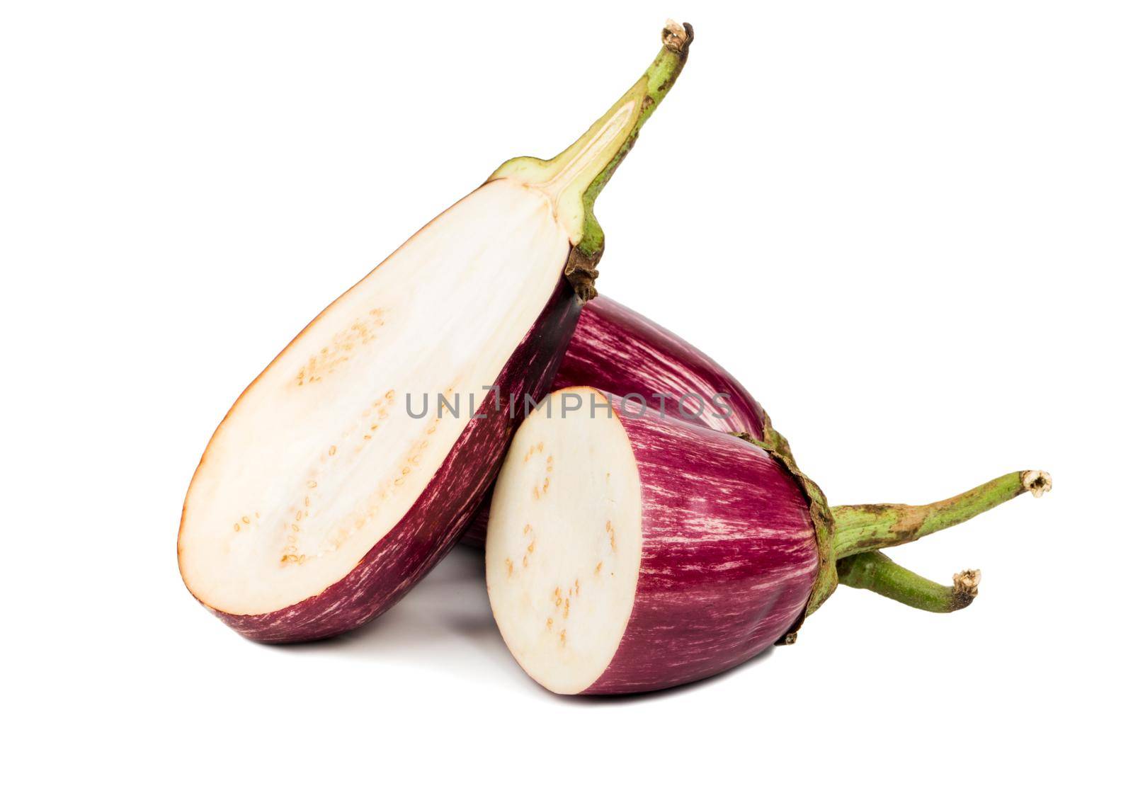 Fresh eggplant with two halves on white background