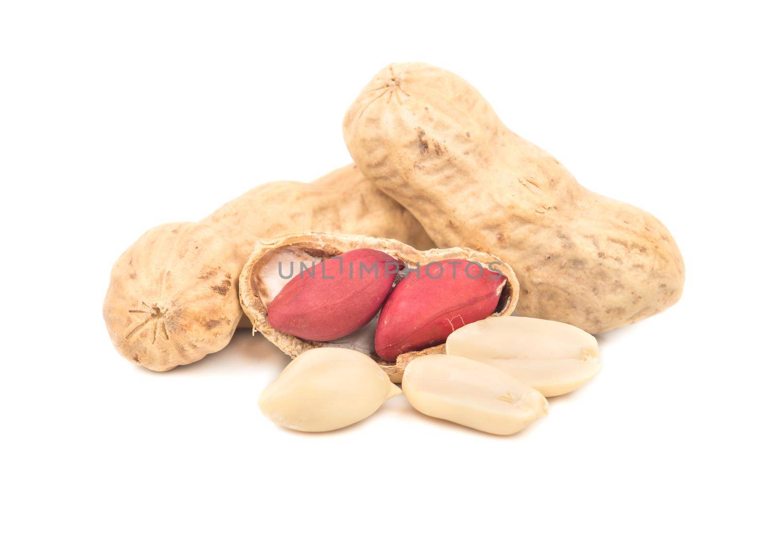 Peanuts in shell and multiple cores on a white background