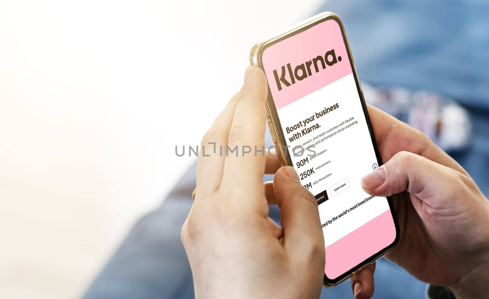 San Francisco, CA, US, July 2022: Female hands holding a phone with Klarna company web page on screen by rarrarorro