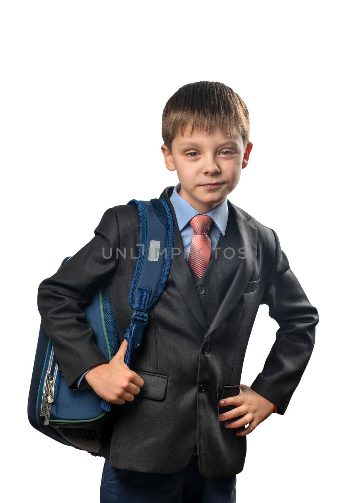 Cute schoolboy with a backpack on a white background