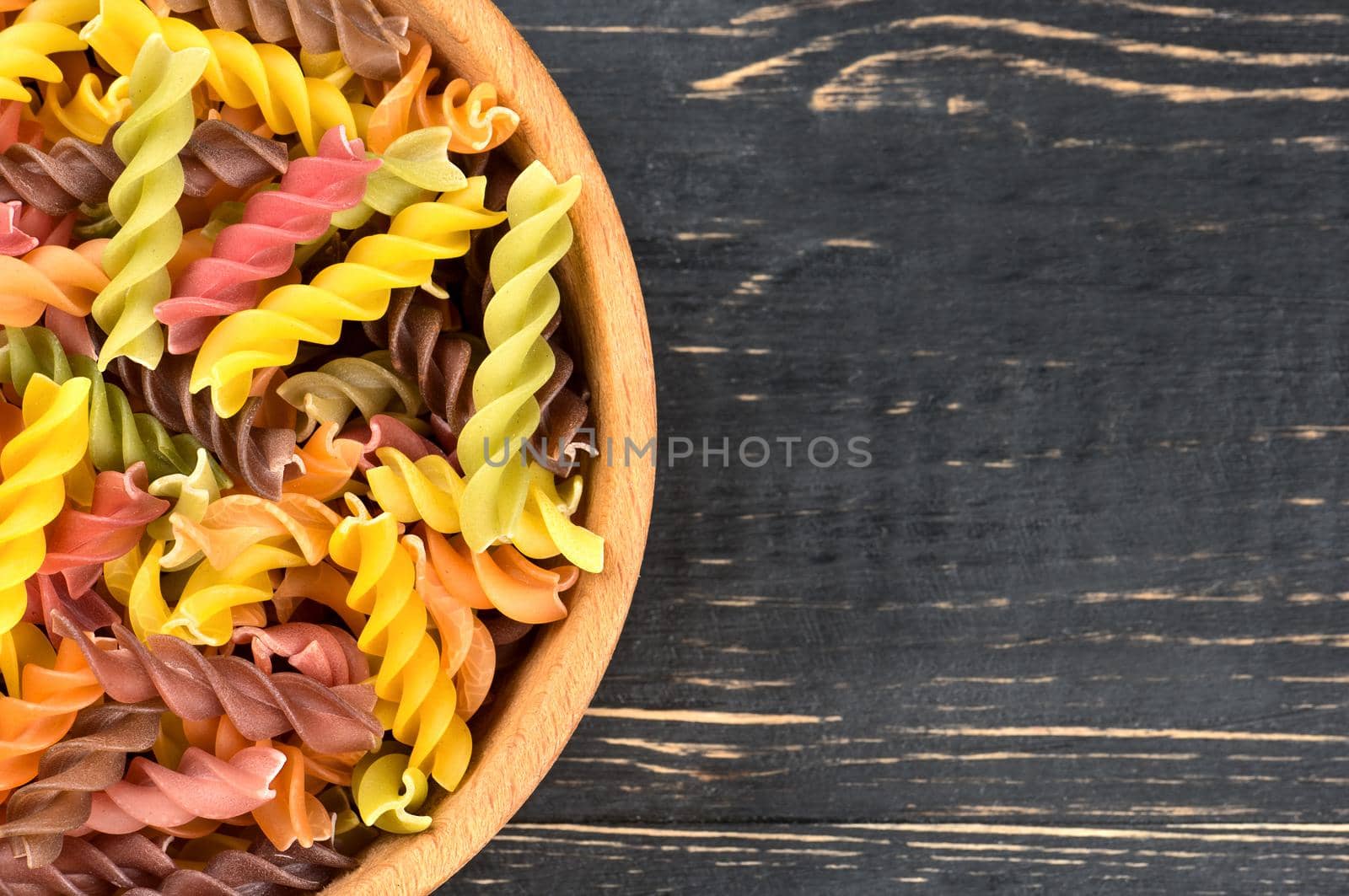 Colorful fusilli pasta in bowl by andregric