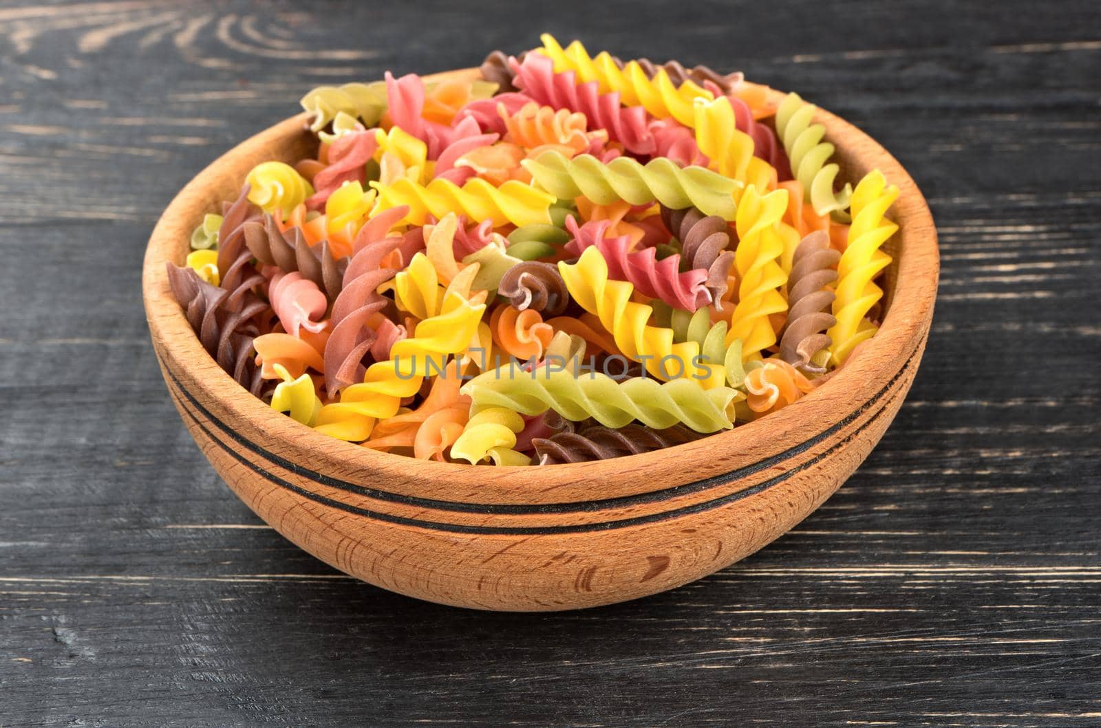 Colorful fusilli pasta in bowl by andregric