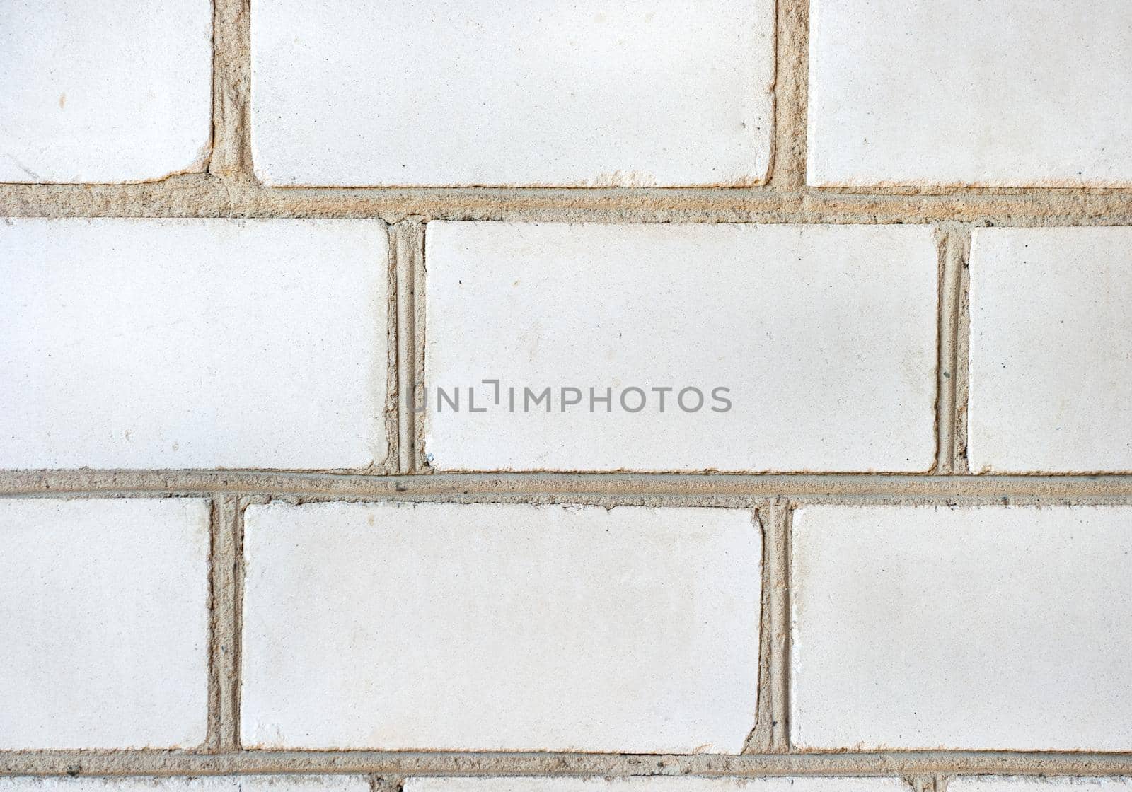 Background of old white brick wall close up