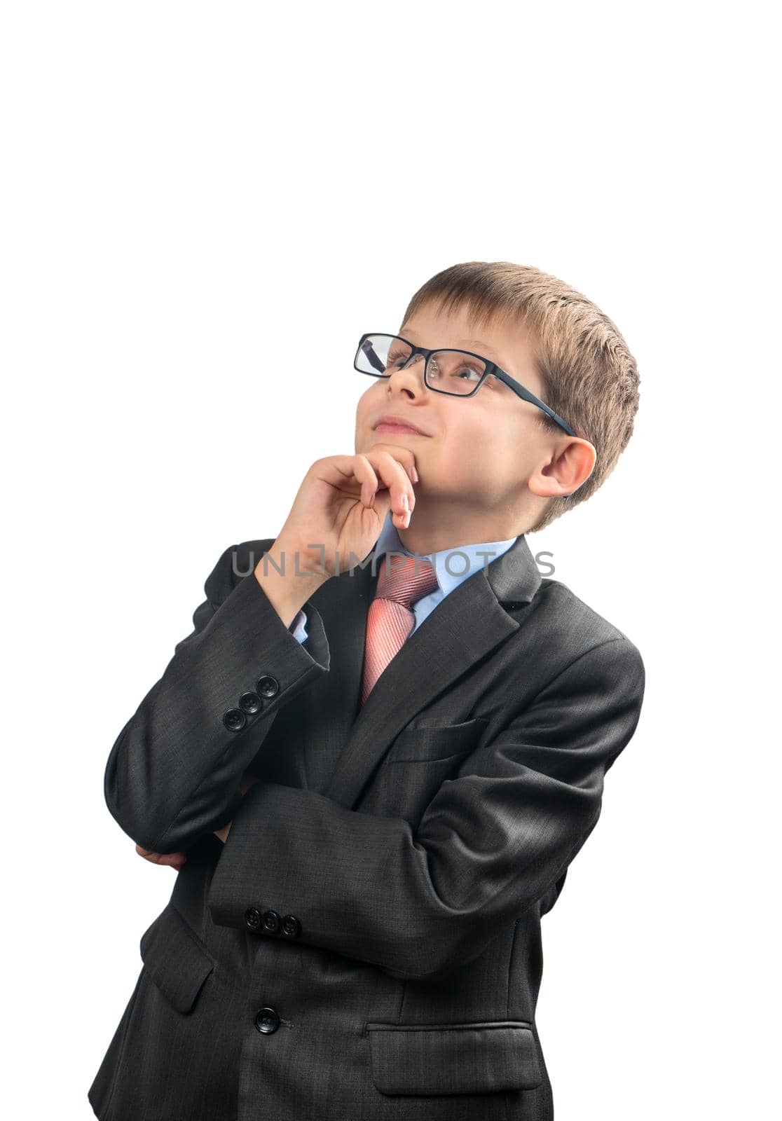 Portrait of a thoughtful schoolboy looking up on a white background