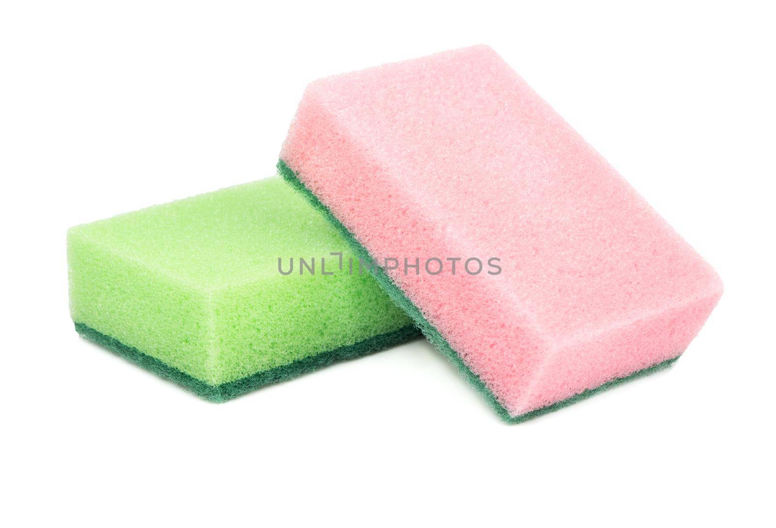 Green and pink dish washing sponge on white background