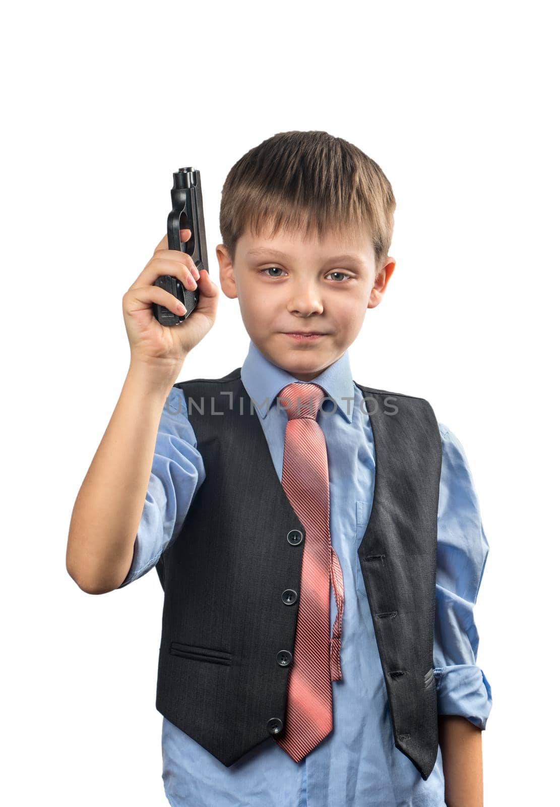 Boy in a tie is holding a gun in his hand on a white background