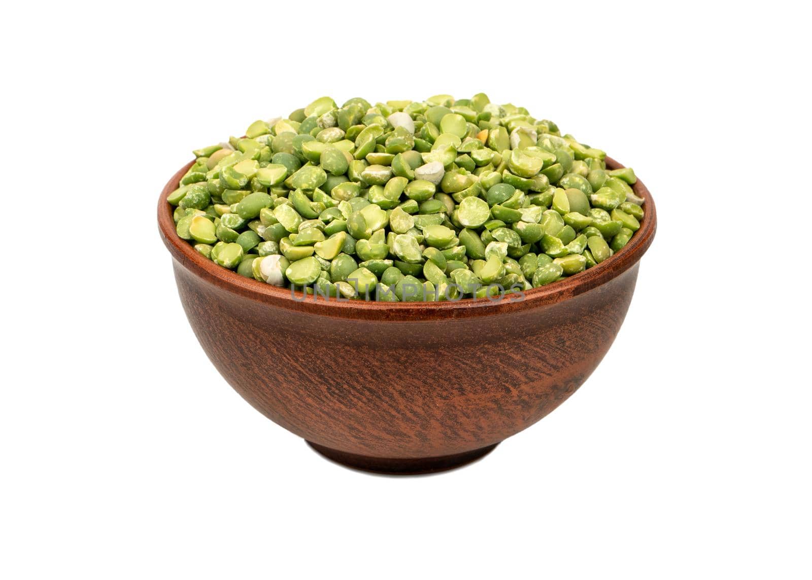 Bowl filled with dry green peas isolated on white background