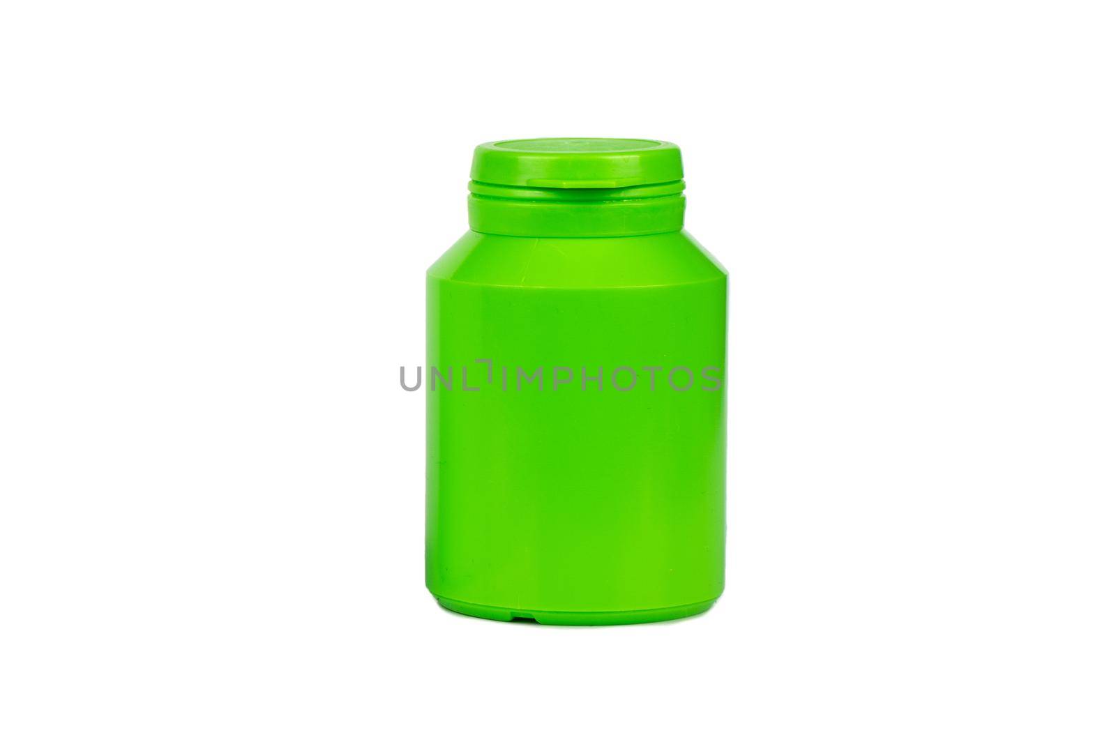 Green plastic jar for tablets and powder on white background