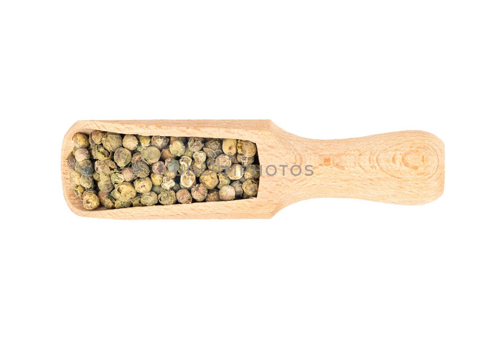 Green pepper peas in wooden scoop on white background, top view