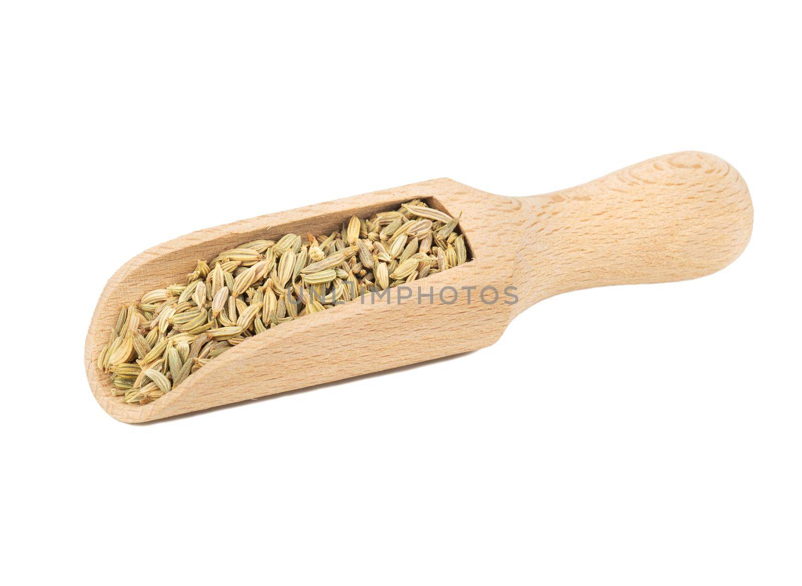 Dry fennel in wooden scoop isolated on white background