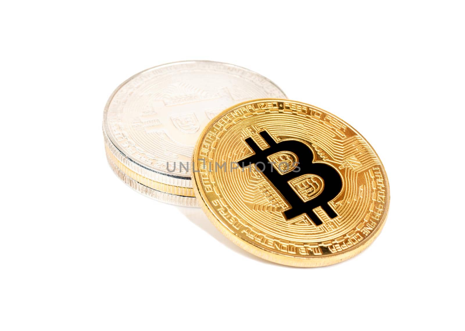 Stack of gold and silver bitcoins on a white background