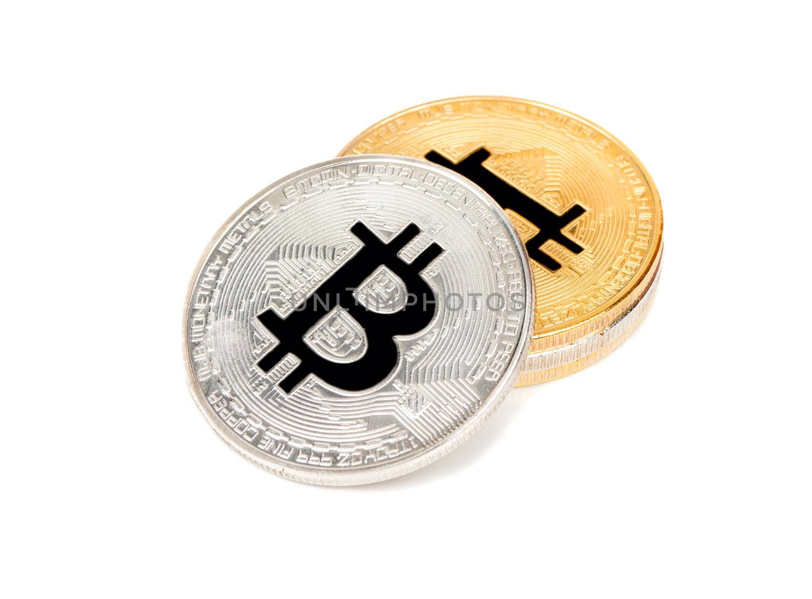 Stack of silver and gold bitcoins on a white background
