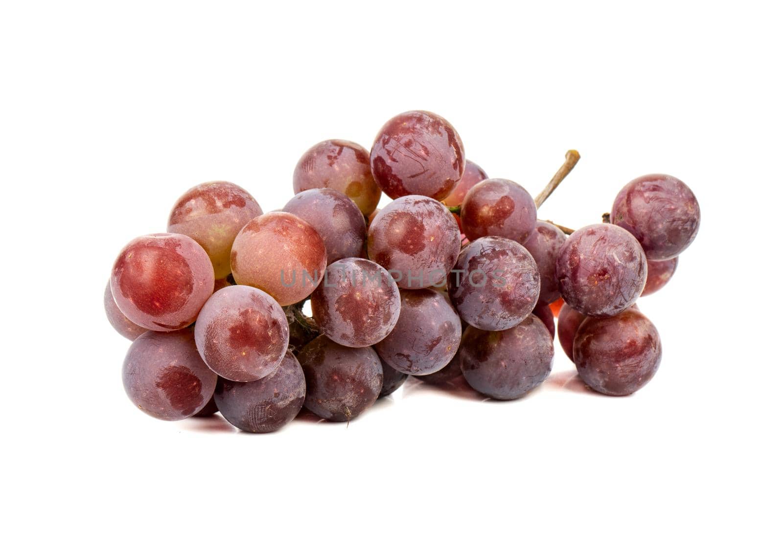 Branch of fresh grapes isolated on white background