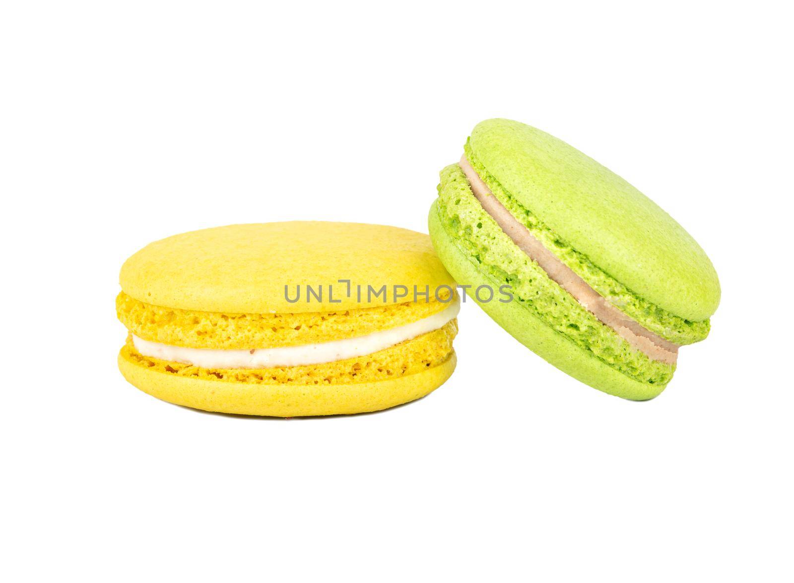 Green and yellow macaroon isolated on white background