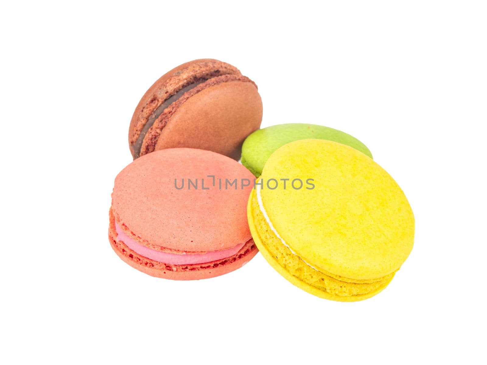 Four multicolored macaroons on a white background