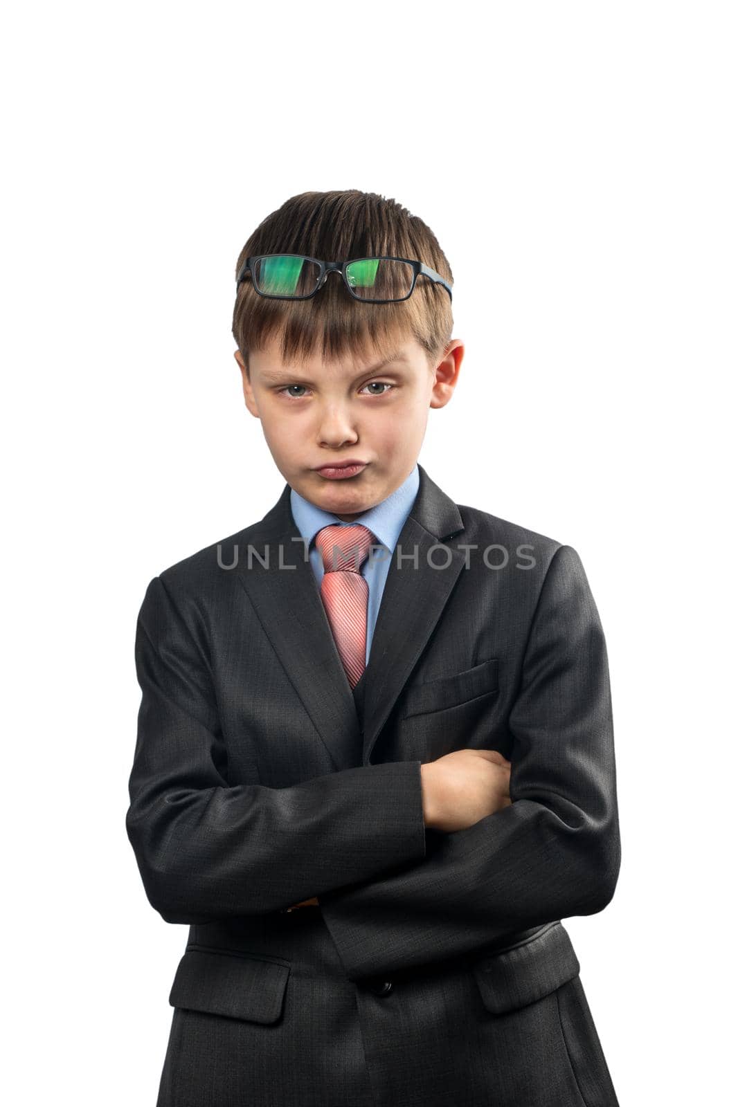 Portrait of a schoolboy making these faces on a white background