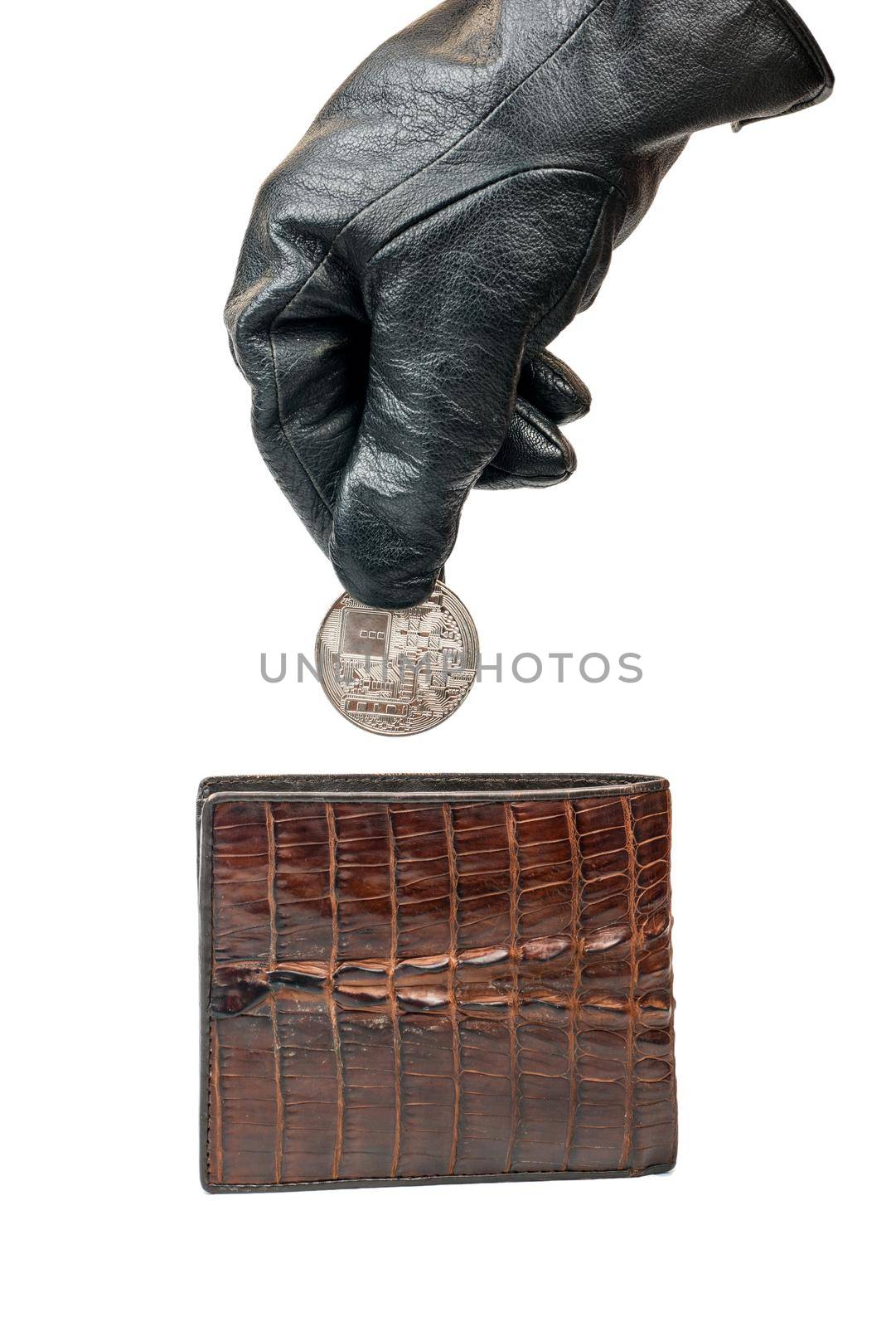 Thief in gloves pulls out a silver coin bitcoin of their wallet on white background