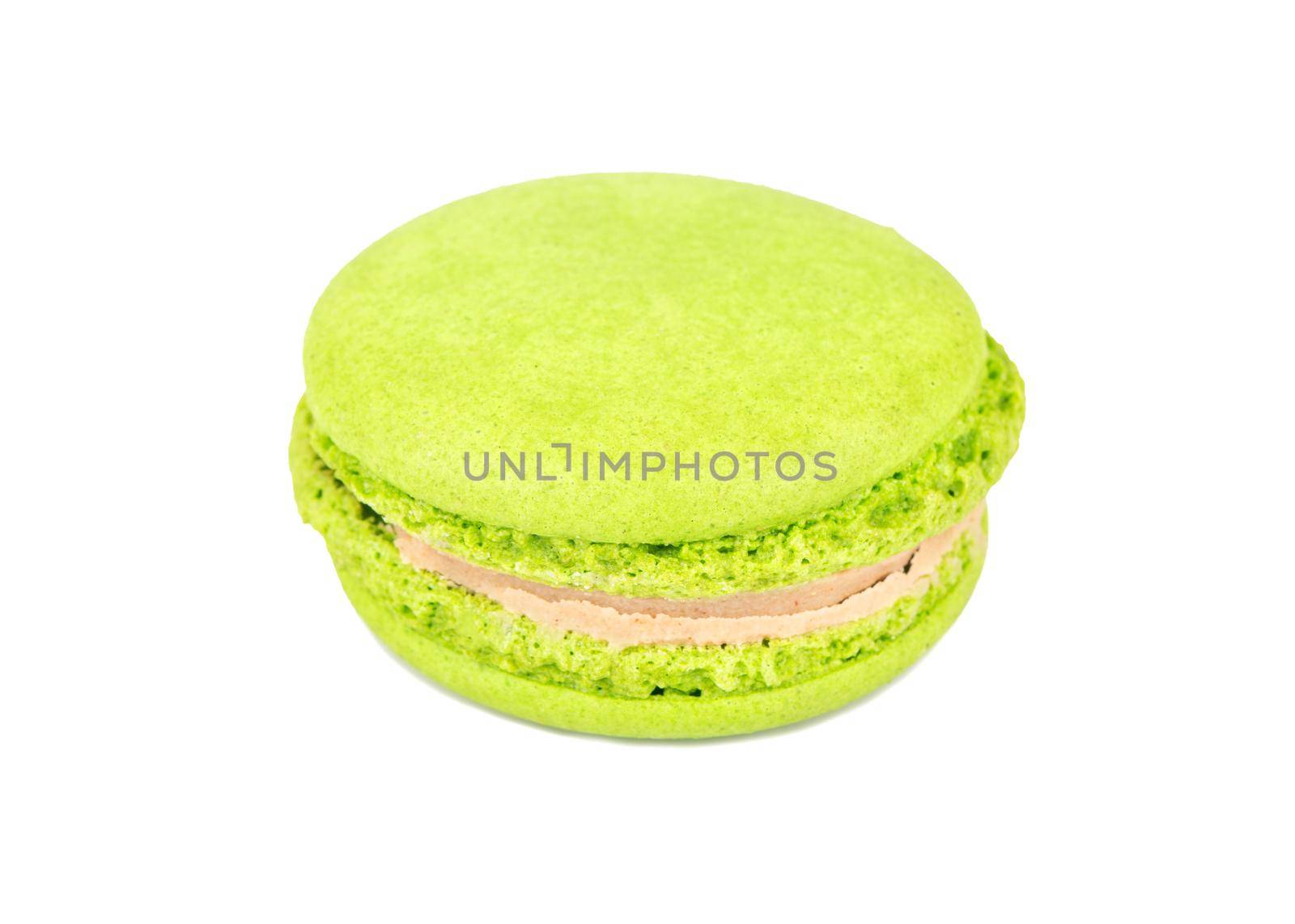 Green pistachio macaroon isolated on white background