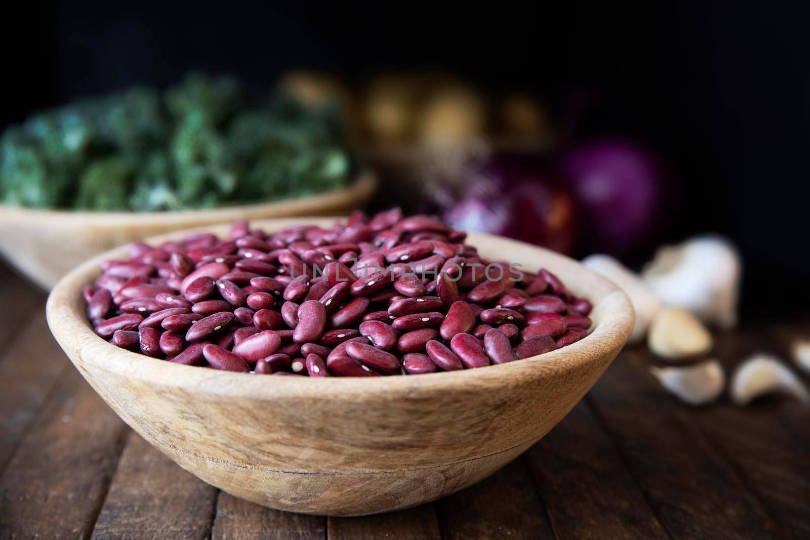 Dried Red Beans in a Wooden Bowl by charlotteLake