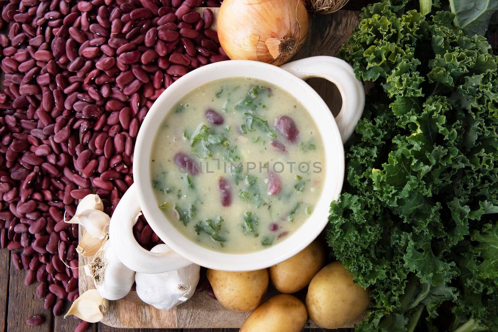 Portuguese Caldo Verde soup flat lay with ingrediients.