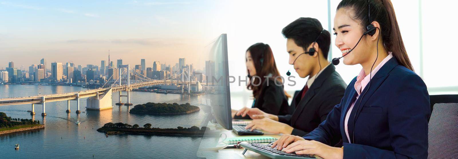 Business people wearing headset working in office in widen view by biancoblue