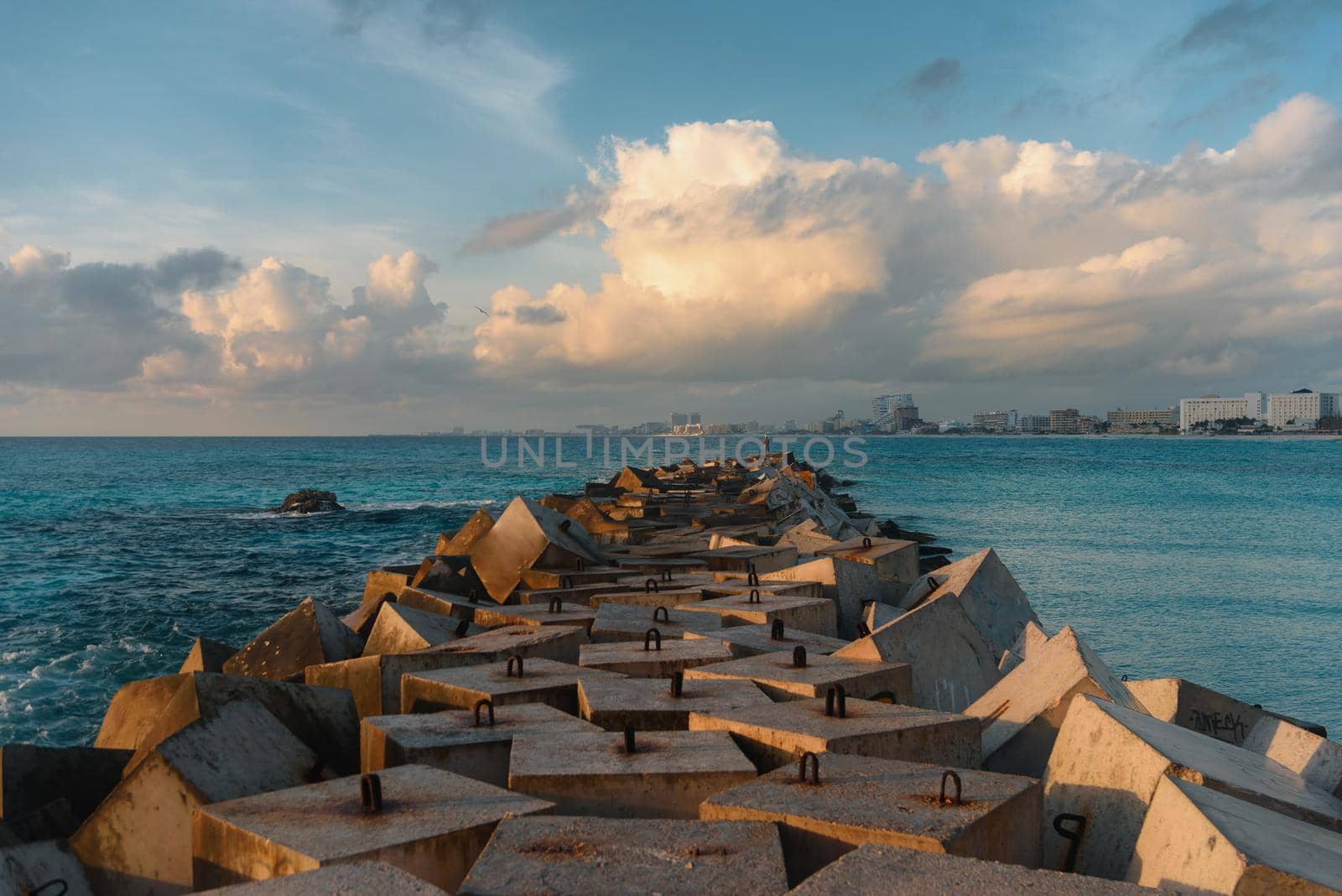 Breakwater made of concrete slabs on the Caribbean Sea. Cancun.