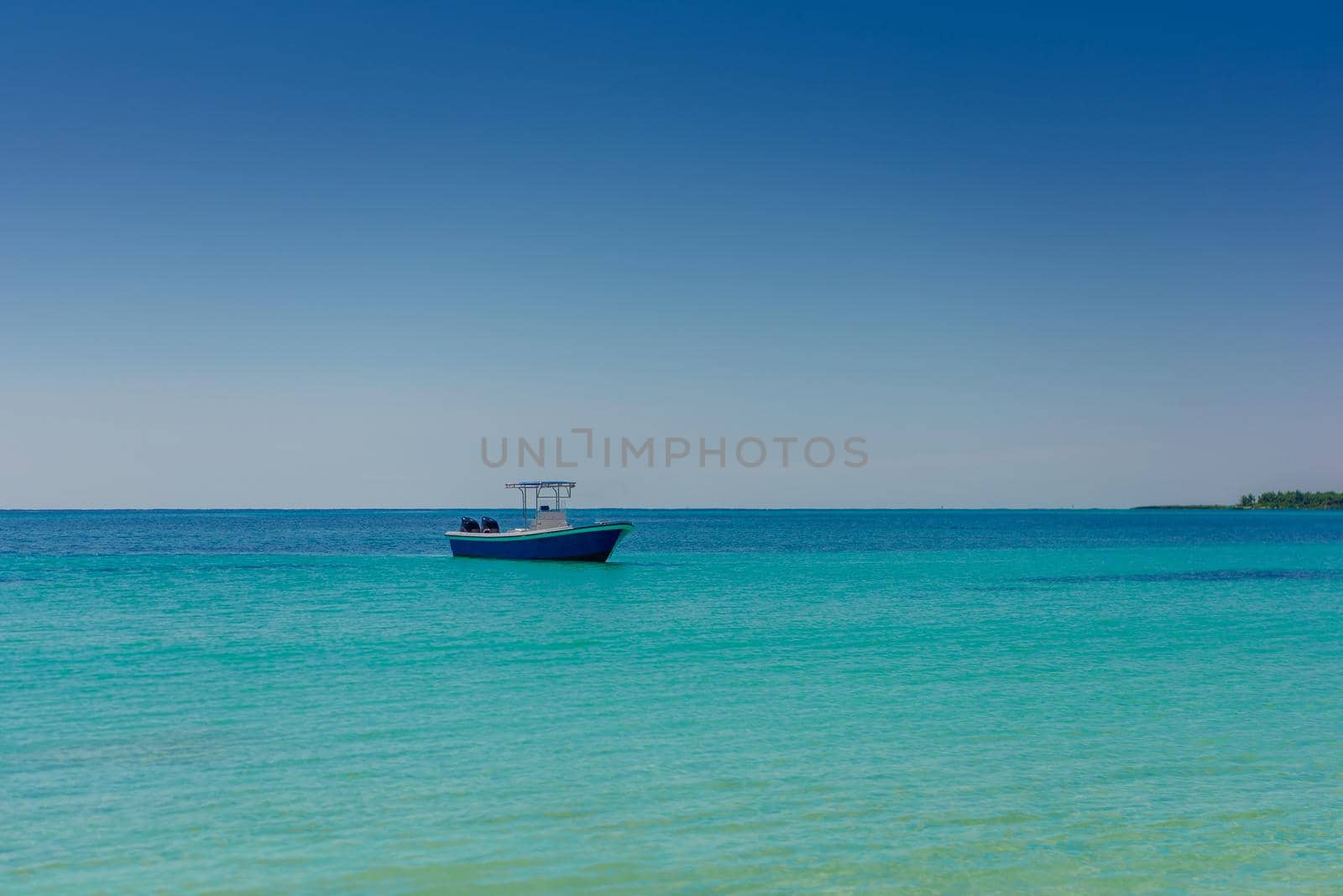 The boat in the Caribbean Sea on a sunny day. Clear water.