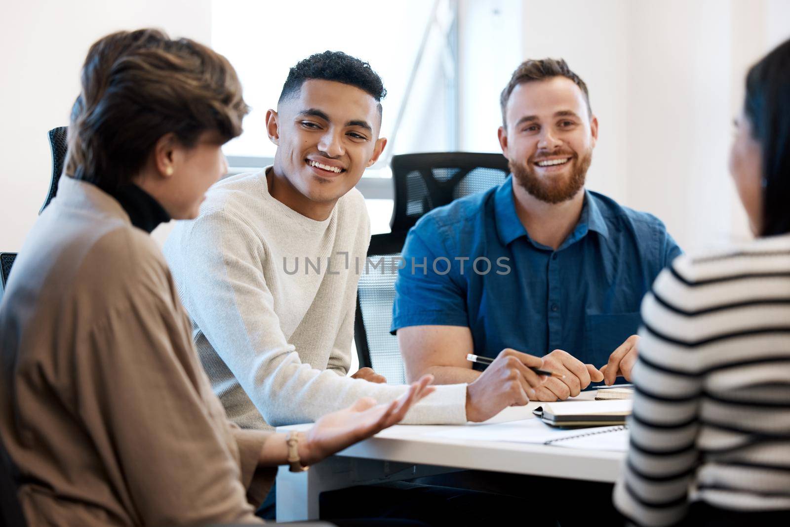 a group of business people during a meeting.