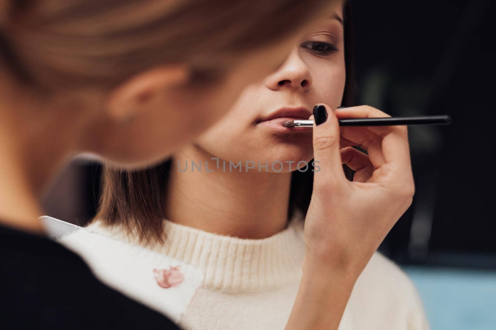 Close Up Female Make Up Artist Working with Client Lips, Young Woman at Procedure in Beauty Salon