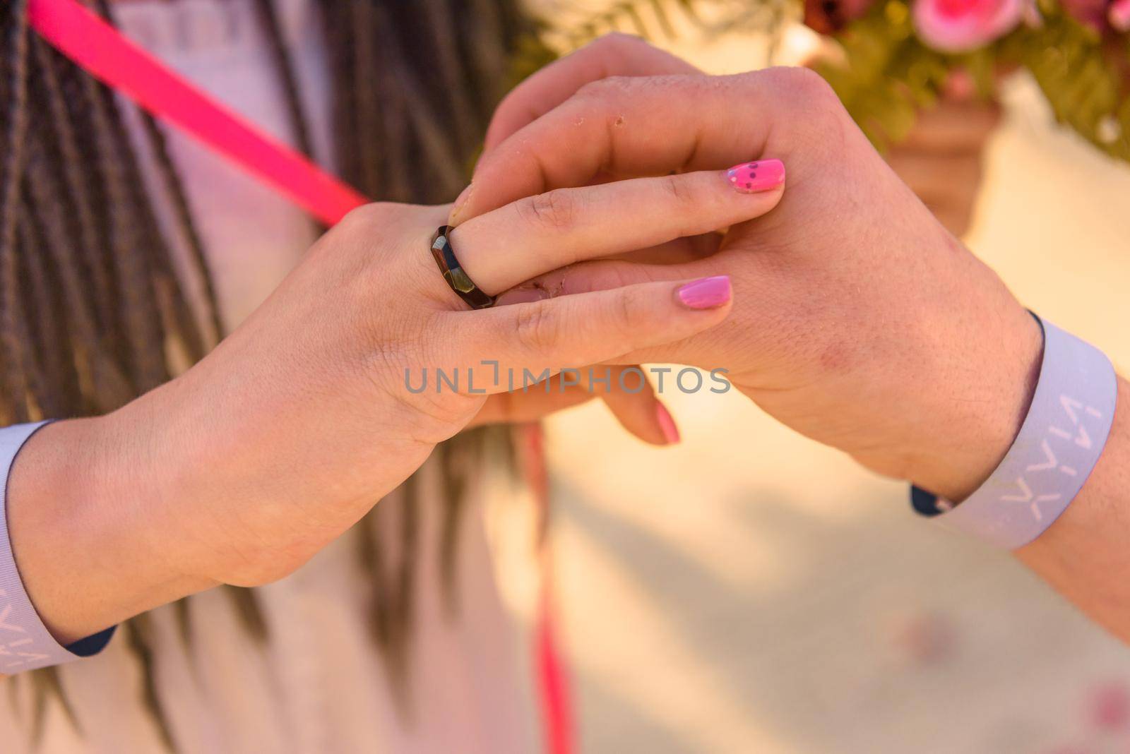 bride and groom exchange rings during the wedding ceremony. Mexico.