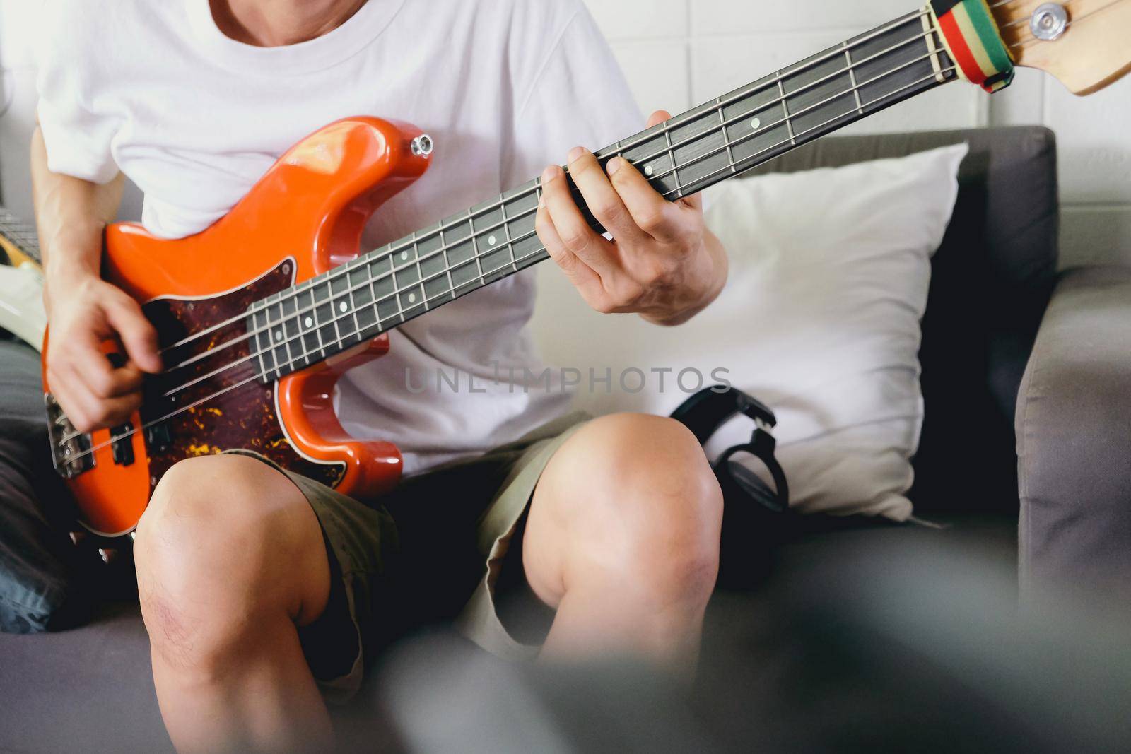 Musician playing bass guitar by ponsulak