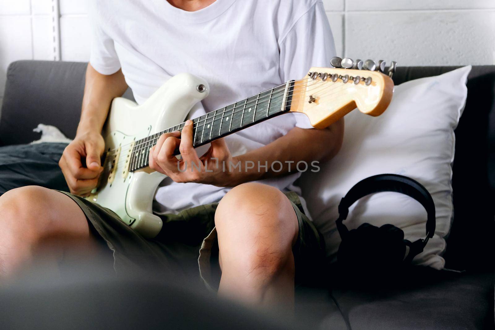 Man playing electrical guitar by ponsulak