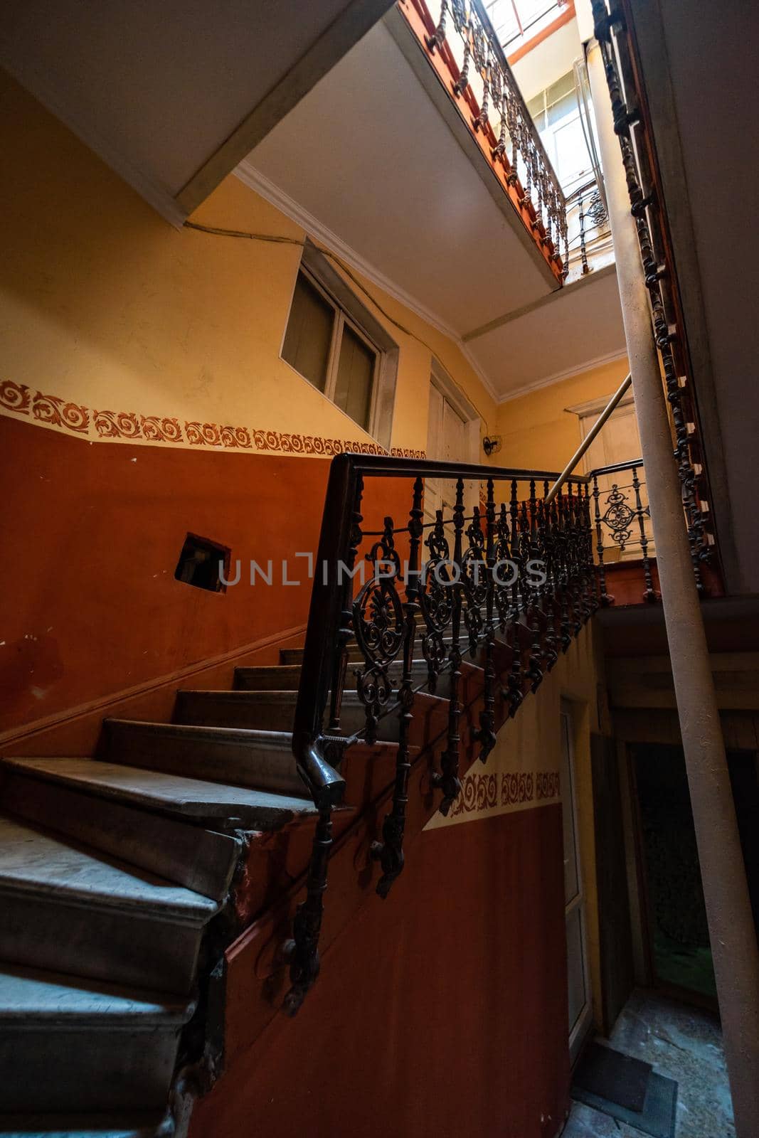 Old Tbilisi's maison stairways with spiral staircase decorated with carving metal holder
