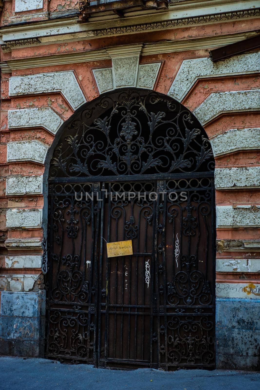Old door with carving in Tbilisi by Elet
