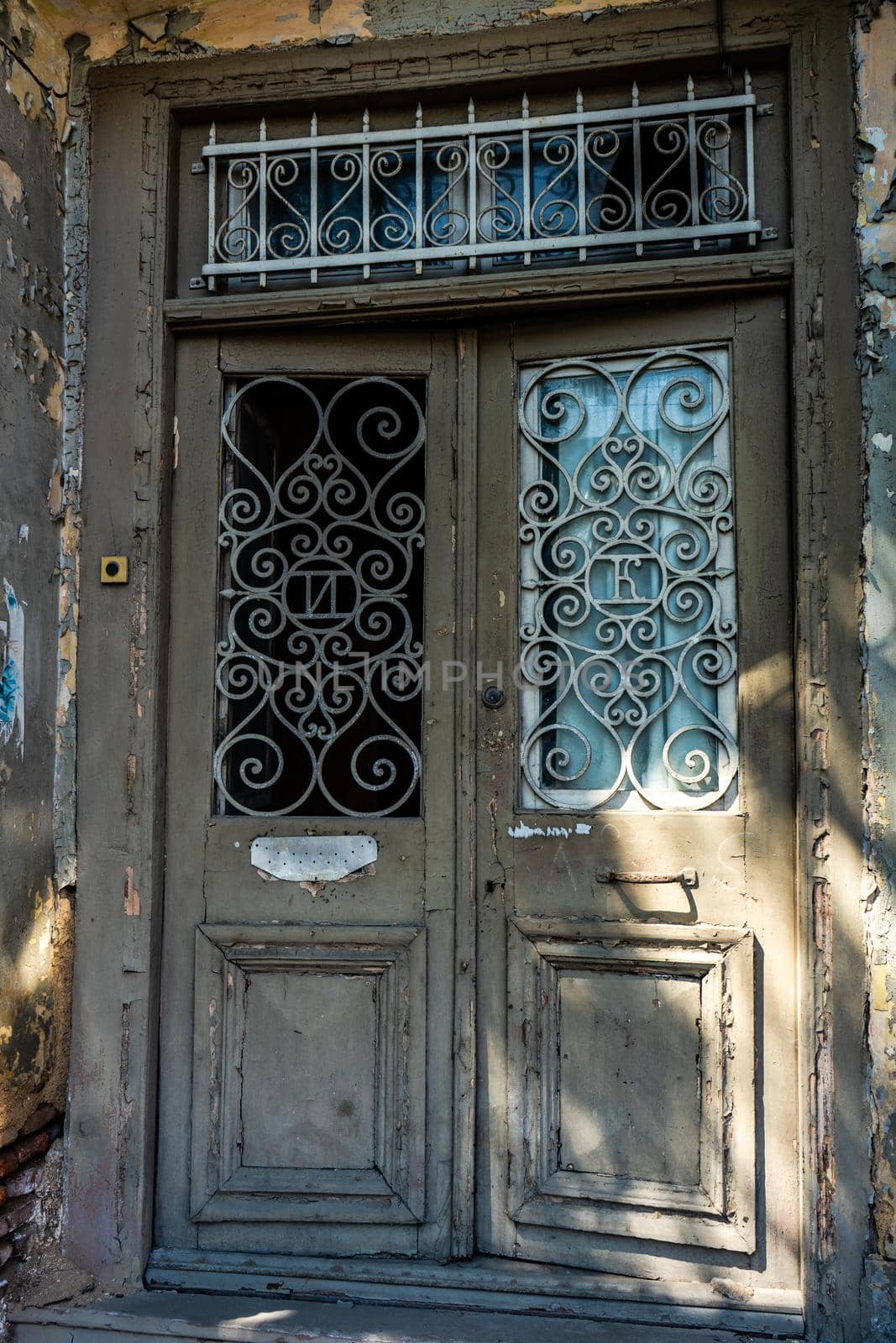 Old door with carving in Tbilisi by Elet