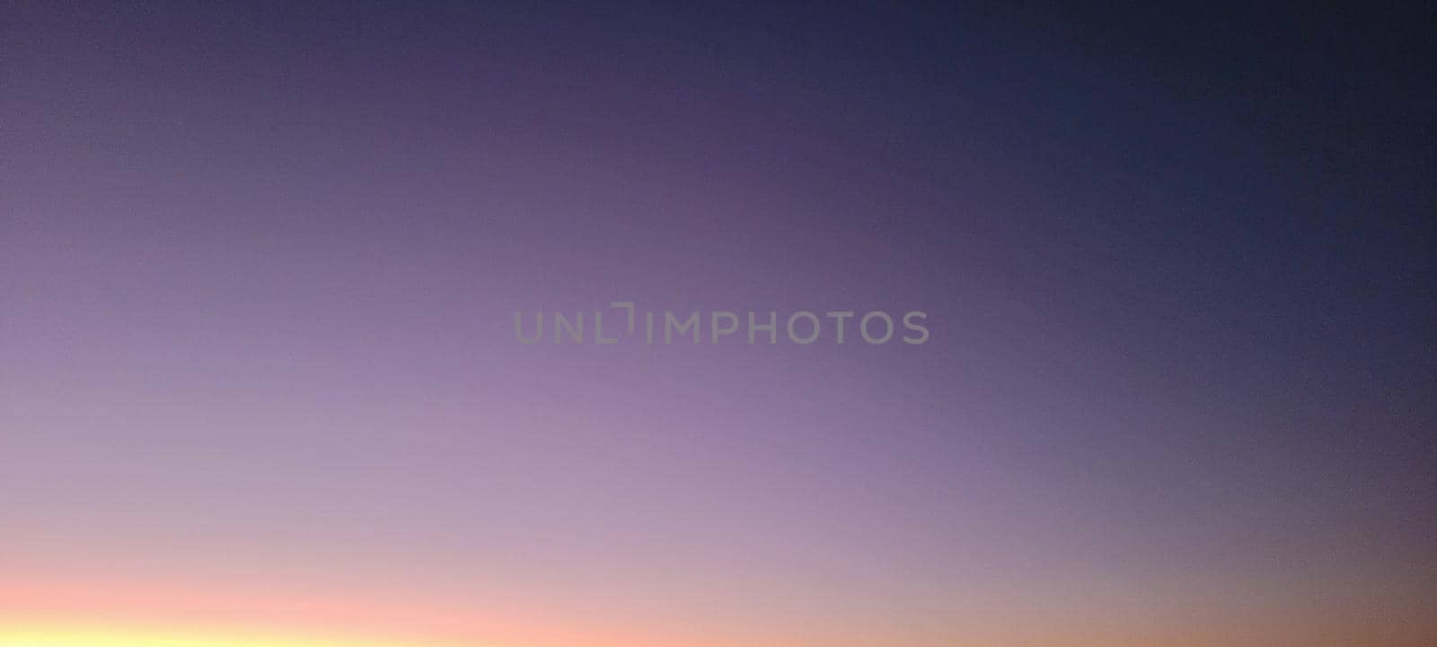 image of colorful sky with dark clouds in late afternoon in Brazil