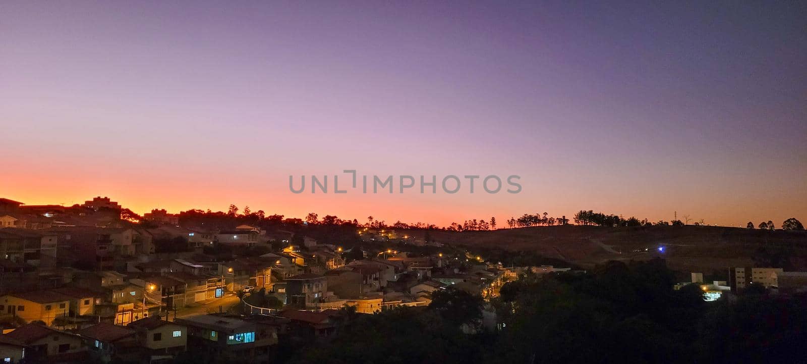 image of colorful sky with dark clouds in late afternoon in Brazil