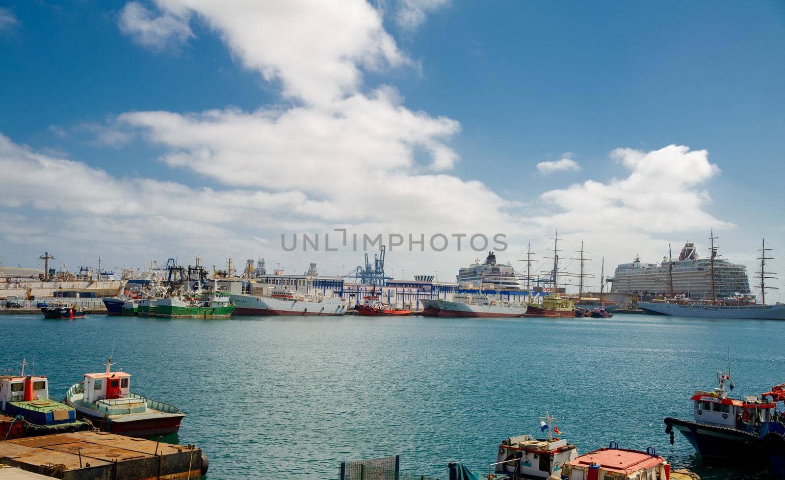 February 04 2022-Las Palmas, Gran Canaria, Spain .View on the Port of Las Palmas, Gran Canary with many kinds of passenger and cargo ships in the background and foreground