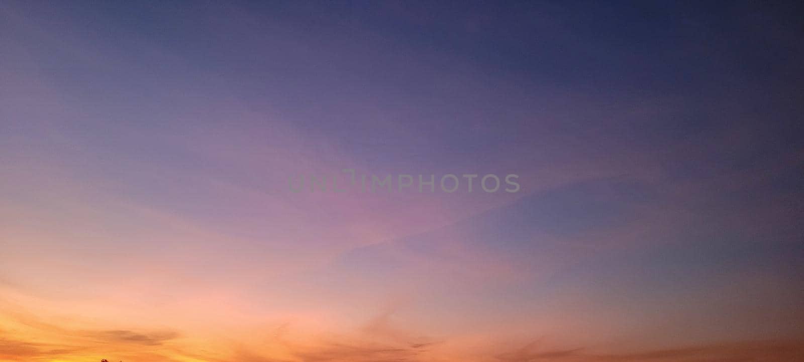 image of colorful sky with dark clouds in late afternoon in Brazil