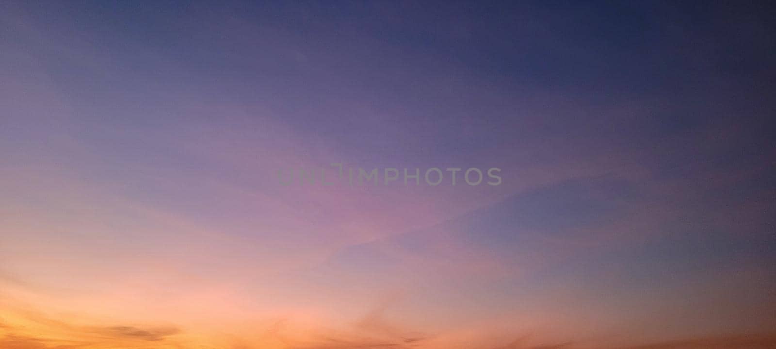 image of colorful sky with dark clouds in late afternoon in Brazil