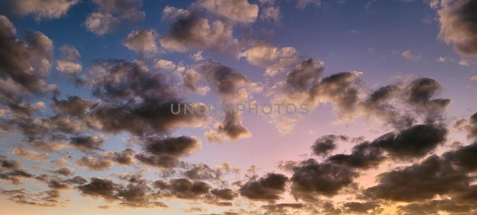 image of colorful sky with dark clouds in late afternoon in Brazil