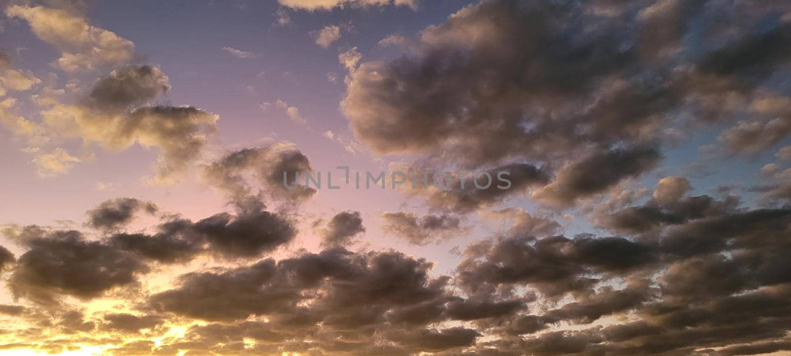 image of colorful sky with dark clouds in late afternoon in Brazil